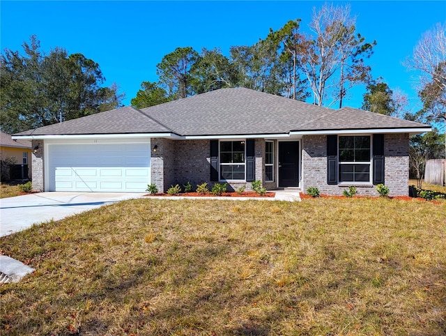 single story home with a garage and a front lawn