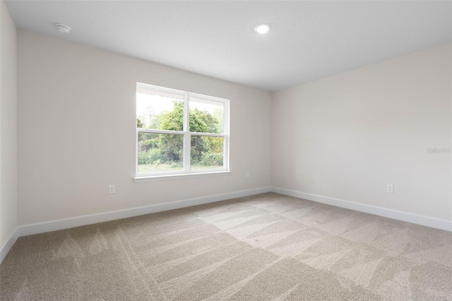 15 Serene Pl, Palm Coast, FL 32164 - unfurnished room featuring light colored carpet, baseboards, a smoke detector, and recessed lighting