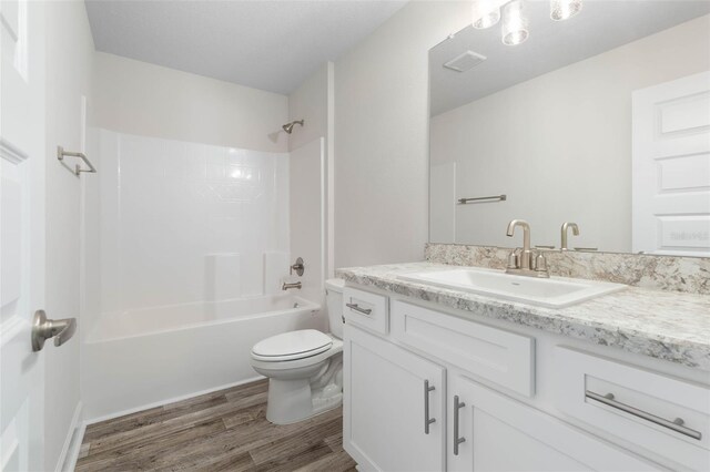 15 Serene Pl, Palm Coast, FL 32164 - full bath featuring wood finished floors, toilet, vanity, and shower / bath combination