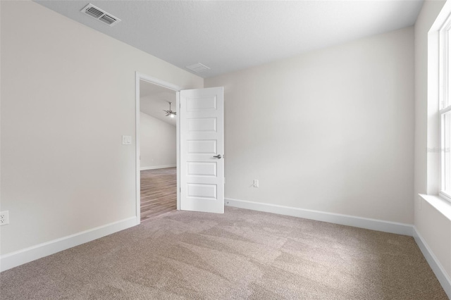 15 Serene Pl, Palm Coast, FL 32164 - carpeted spare room featuring healthy amount of natural light and baseboards