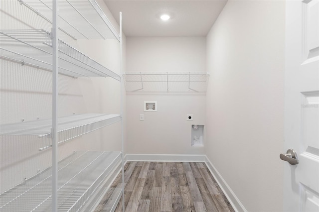 15 Serene Pl, Palm Coast, FL 32164 - clothes washing area with hookup for a washing machine, wood finished floors, baseboards, hookup for an electric dryer, and recessed lighting
