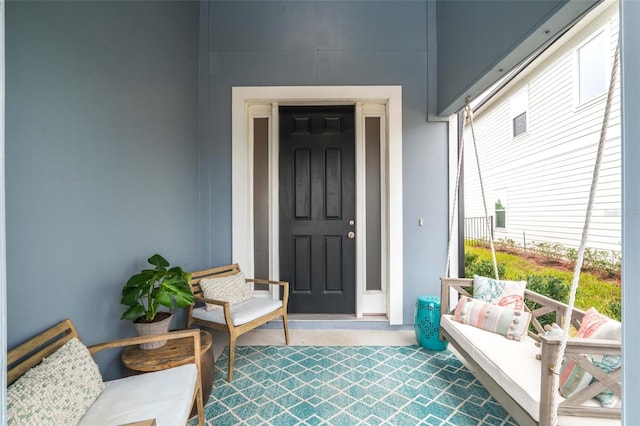 property entrance with covered porch