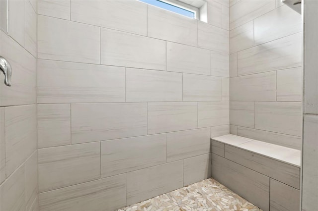 full bath with tiled shower