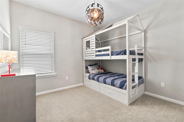 carpeted bedroom featuring baseboards