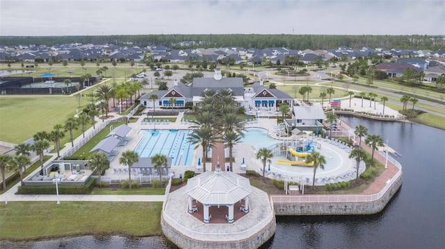 birds eye view of property featuring a residential view and a water view