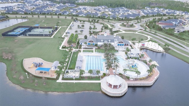 bird's eye view with a water view and a residential view