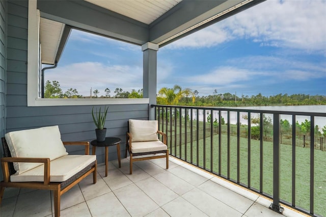 balcony featuring a water view