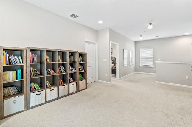 living area with recessed lighting, carpet, visible vents, and baseboards