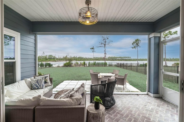 sunroom with a water view