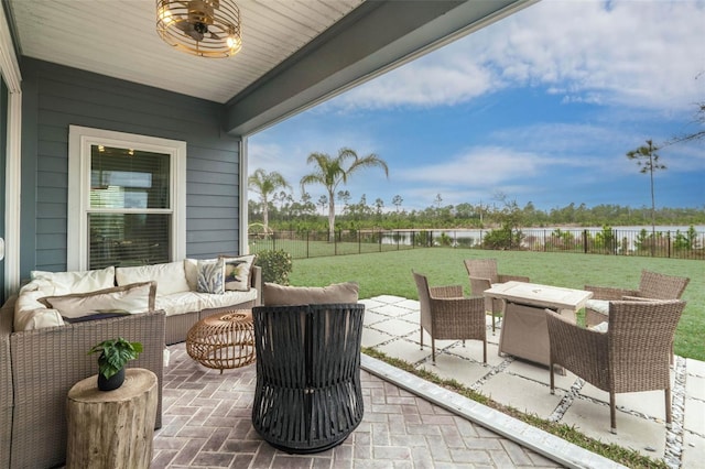 view of patio / terrace featuring outdoor lounge area and fence