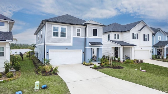 view of front facade featuring an attached garage, driveway, and fence