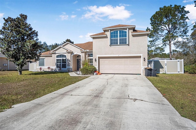 view of front of house with a garage and a front lawn