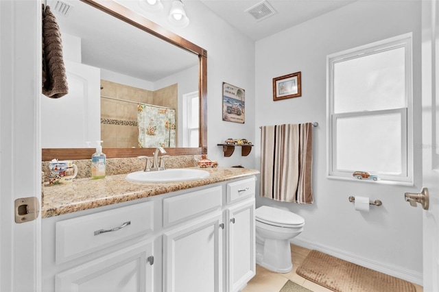 bathroom featuring vanity, plenty of natural light, curtained shower, and toilet