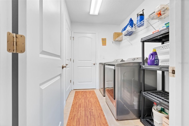 washroom with separate washer and dryer