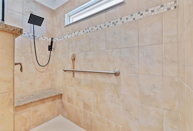 bathroom featuring a tile shower