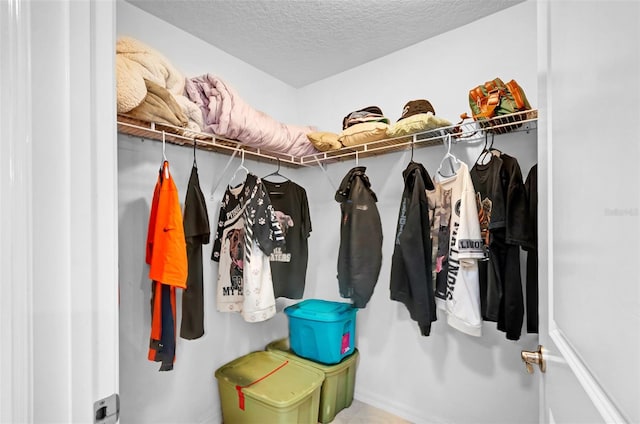 mudroom with a textured ceiling