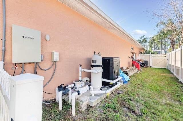 exterior space with cooling unit and a yard