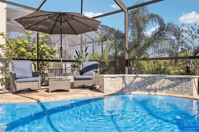 outdoor pool featuring a lanai and a patio area