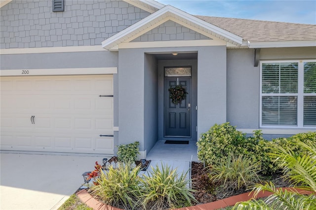 view of exterior entry featuring a garage