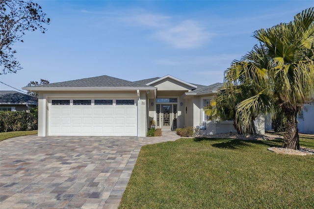 view of front of home featuring a garage and a front yard