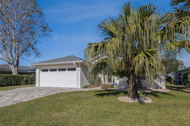 view of front of home featuring a garage and a front yard