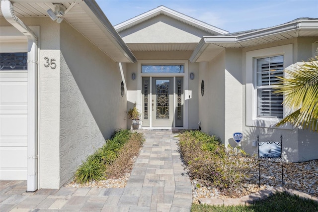 entrance to property featuring a garage