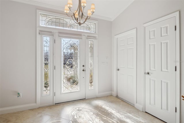 tiled entryway with crown molding and a notable chandelier