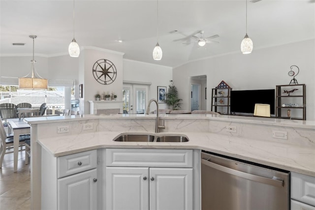 kitchen featuring sink, stainless steel dishwasher, white cabinets, and light stone counters