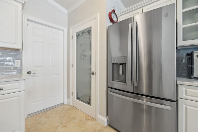 kitchen with white cabinetry, backsplash, ornamental molding, and stainless steel refrigerator with ice dispenser