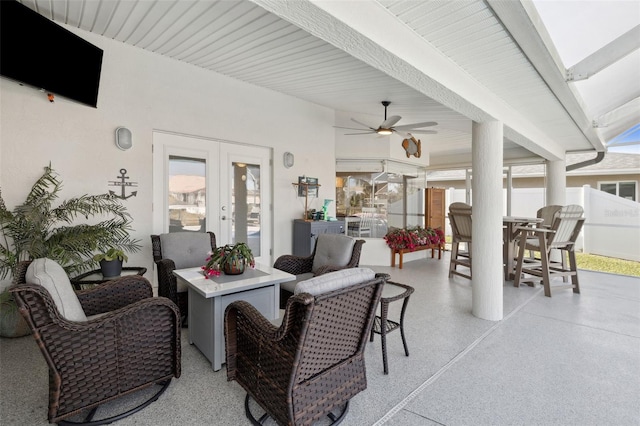 view of patio / terrace featuring french doors, ceiling fan, and an outdoor living space