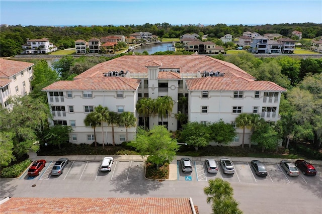 birds eye view of property with a water view