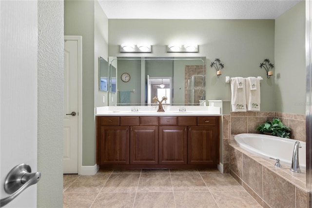 bathroom with vanity, separate shower and tub, and tile patterned flooring