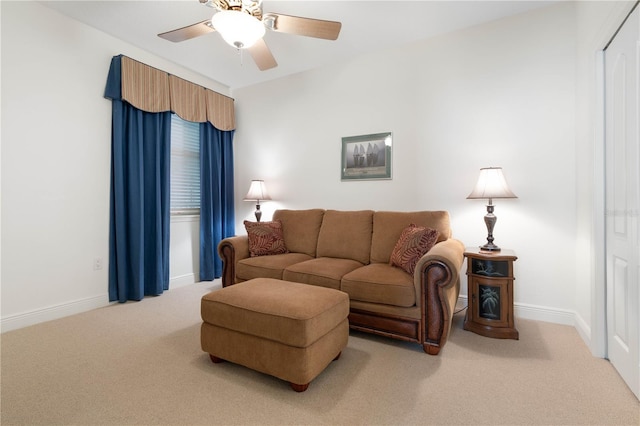 carpeted living room featuring ceiling fan