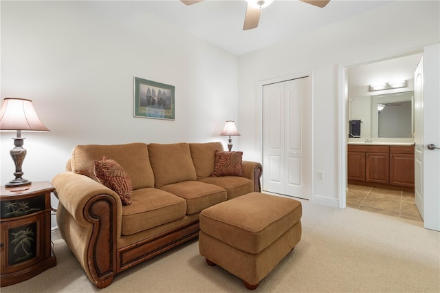 living room with light carpet and ceiling fan