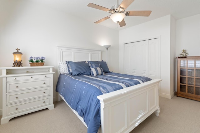 carpeted bedroom featuring a closet and ceiling fan