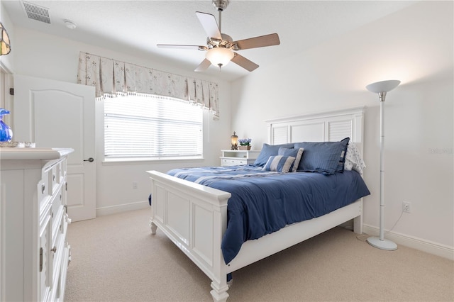 bedroom with light colored carpet and ceiling fan