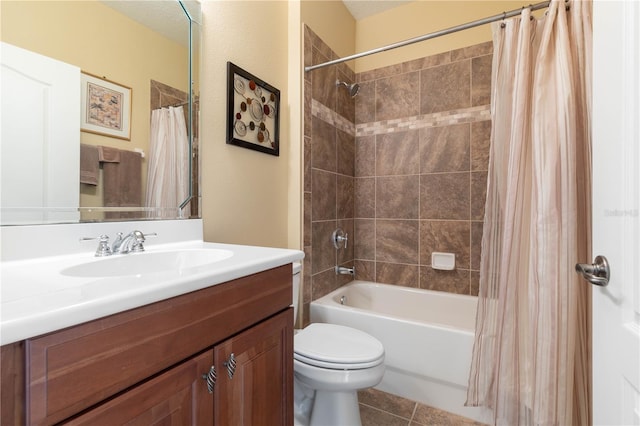 full bathroom featuring vanity, shower / tub combo with curtain, tile patterned floors, and toilet