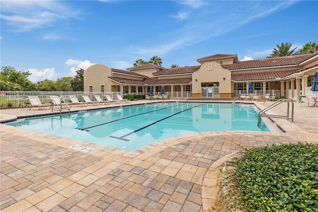 view of swimming pool featuring a patio area