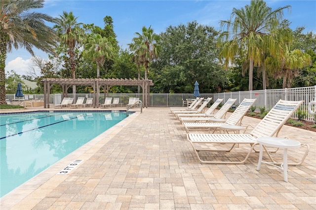 view of pool with a pergola and a patio area