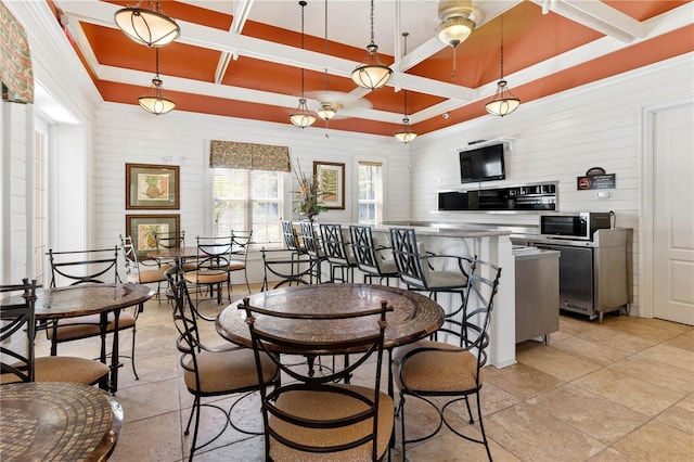 dining room with coffered ceiling and beam ceiling