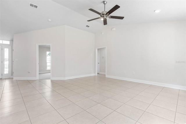 tiled empty room with lofted ceiling and ceiling fan