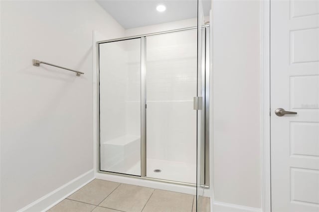 bathroom featuring tile patterned flooring and walk in shower