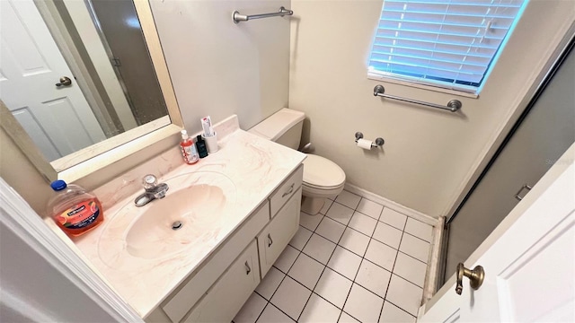 bathroom featuring tile patterned flooring, an enclosed shower, vanity, and toilet