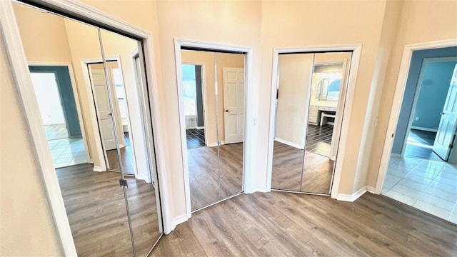 hall with hardwood / wood-style floors