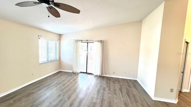 spare room featuring ceiling fan, wood-type flooring, and a textured ceiling