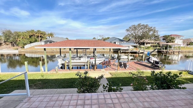 dock area featuring a water view and a lawn