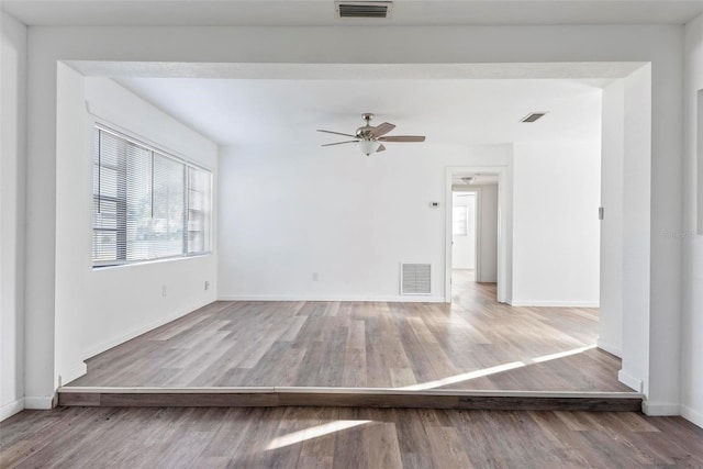 spare room featuring hardwood / wood-style flooring and ceiling fan