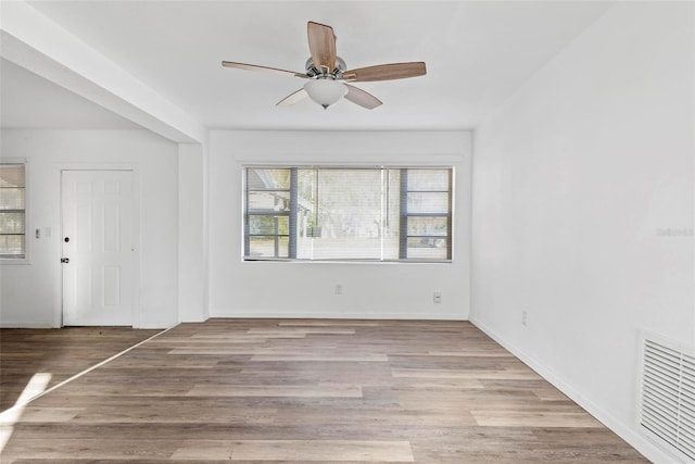 unfurnished room with ceiling fan and light hardwood / wood-style flooring