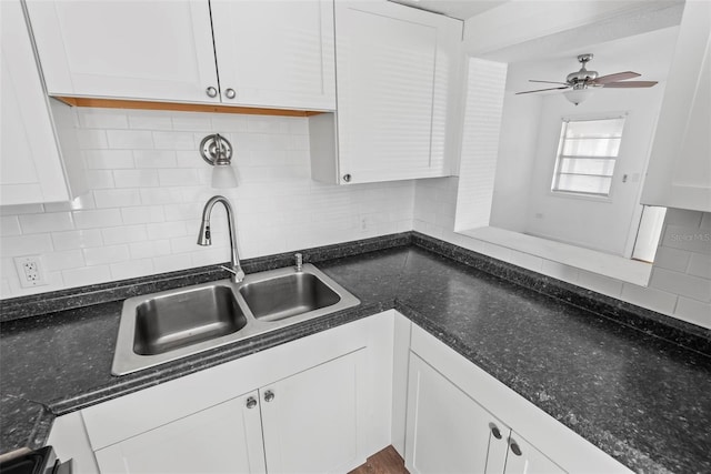 kitchen with white cabinetry, ceiling fan, sink, and tasteful backsplash