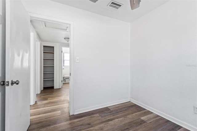 spare room with dark hardwood / wood-style floors and ceiling fan